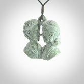 Hand carved New Zealand Kokopu jade contemporary couple face pendant. Hand made for you by NZ Pacific. Hand carved jewellery made from real New Zealand jade and for sale online. One only pendant with adjustable green cord.